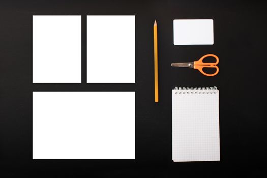 Mock ups on the black background. Templates blank with stationery. View top. Flat lay