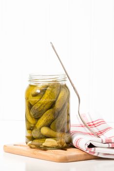 Jar of delicious whole garlic dill pickles.