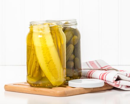 Jars of sweet bread and butter and dill pickles.