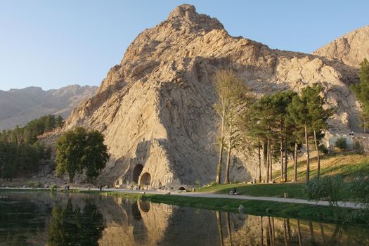 KERMANSHAH, IRAN - OCTOBER 3, 2016: Caves Taq-e Bostan on sundown, historical site of Kermanshah on October 3, 2016 in Iran, Asia