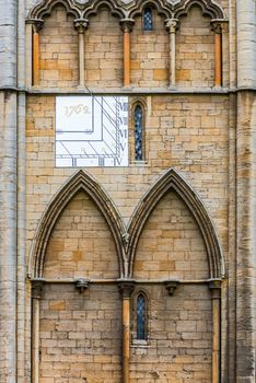 Peterbourough cathedral UK Lincolnshire facade detail showing a sundial