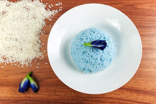 Blue Rice made cooking from Butterfly Pea flower (Clitoria ternatea L) in white dish. Rice has a colorful and fragrant flowers and good for health.