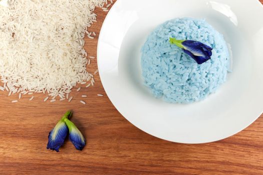 Blue Rice made cooking from Butterfly Pea flower (Clitoria ternatea L) in white dish. Rice has a colorful and fragrant flowers and good for health.