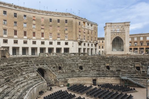 Street view of Roman Amphiteatre in Sant Oronzo square in Lecce, Italy. Built in the 2nd century, this theatre was able to seat more than 25,000 people