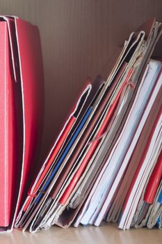 Stacks of colored folders with documents on the desktop