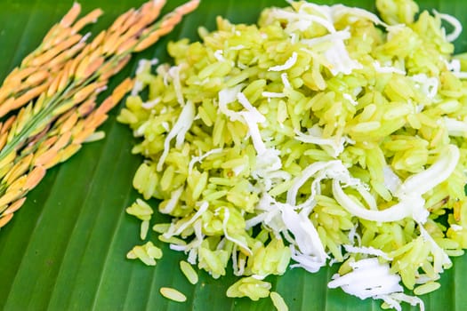 shredded rice grain with coconut, traditional Thai dessert on banana leaf