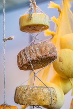 set of hard cheese roped round form