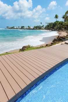 Tropical beach Tobago Caribbean nearby pool and wooden deck