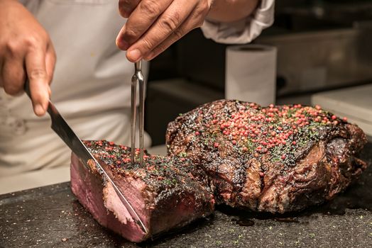 Carving of Wagyu beef roast