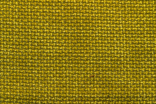 Rustic canvas fabric texture in yellow color.