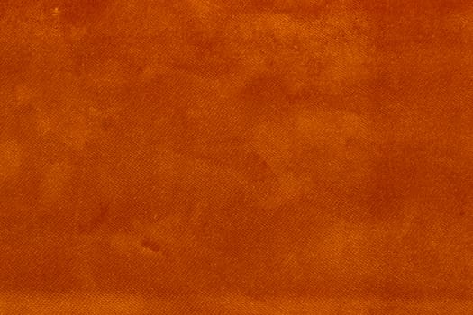 The Velvet fabric texture in orange color.