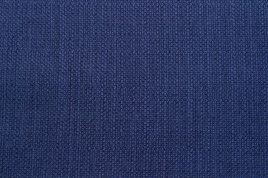 Rustic canvas fabric texture in blue color.