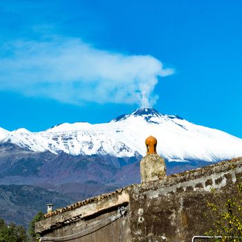 view of the Etna volcano covered by the first winter snow