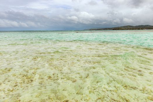 Nylon Pool in Tobago tourist attraction shallow depth of clear sea water covering coral and white sand panoramic view