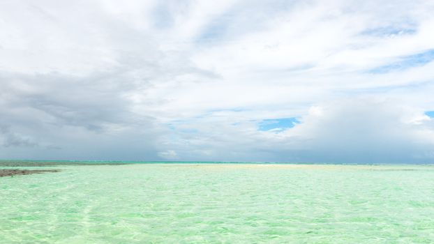 Nylon Pool in Tobago tourist attraction shallow depth of clear sea water covering coral and white sand panoramic view