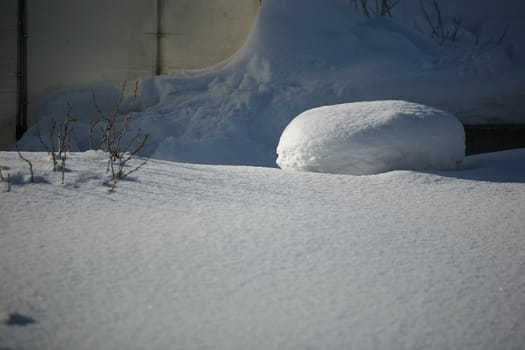 Background of wavy fresh snow with blue tint