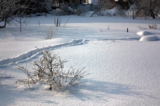 Early morning Shadows on uneven snow. The landscape of the Ural winter.
