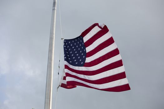 American flag at half mast for mourning and holidays