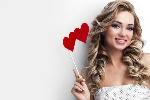 Portrait of pretty woman holdng hearts on stick, Valentines day conceot