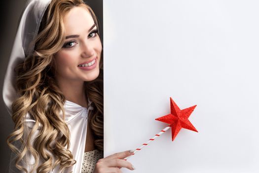 Fairy woman with magic wand with star pointing at white background