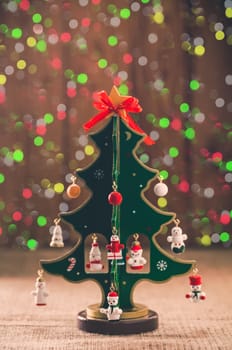 decorative Christmas tree on a background colored lights