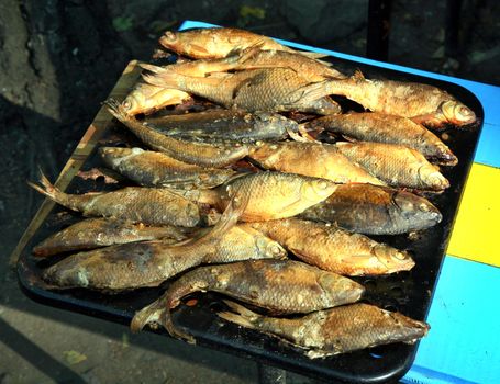 Fresh hot smoked fish on the on a baking sheet