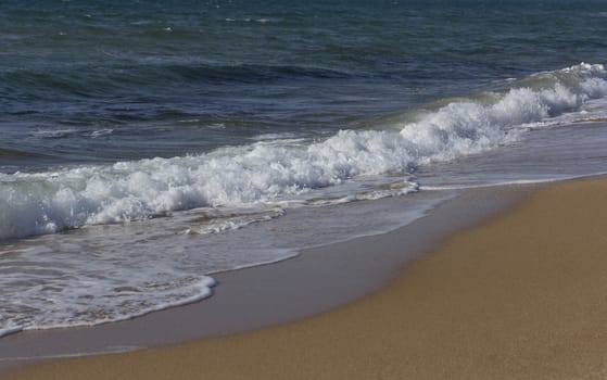 Wave of the sea on the sand beach