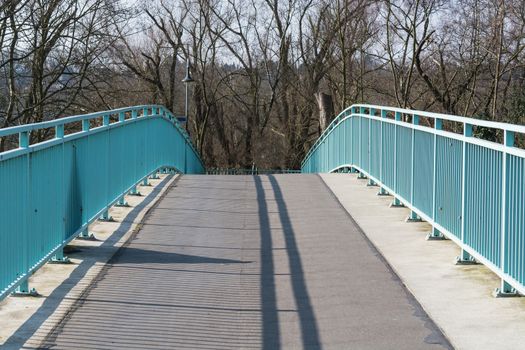 Pedestrian bridge steel arch structure over the river Ruhr in Muelheim, Germany.