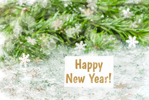 Fir tree branch and snow flares confetti with Happy New Year text lettering. New Year concept