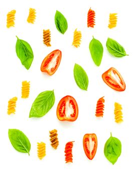 Italian food concept Fusilli with tomato and sweet basil isolate on white background. Fusilli and ingredients with flat lay.