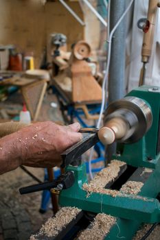 A man working wood with turner carpentry