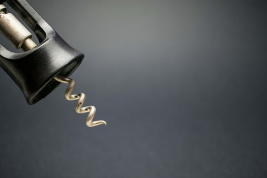 A corkscrew, tool used to open bottles of wine