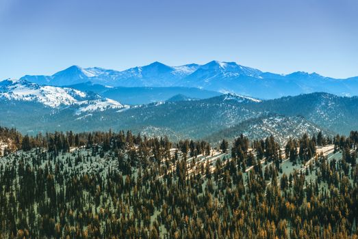Sierra Nevada mountain range in winter seen from the north side of the Lake Tahoe.