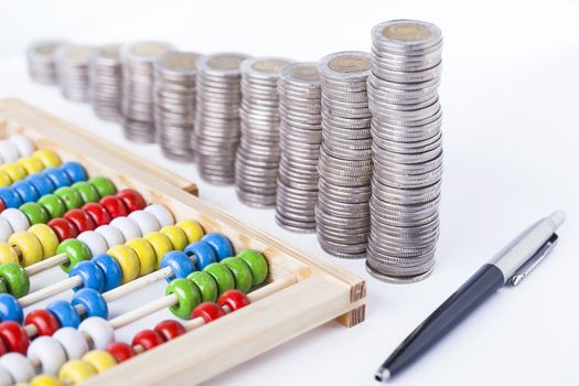 counting income, pile of money, calculator in white background