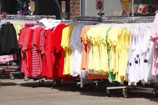Colorful shirts on a clothes rail