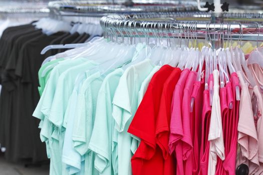 Colorful shirts on a clothes rail