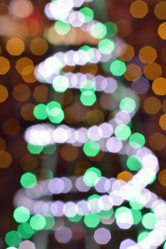 Holiday Background Abstract Christmas illumination blur lights in vertical frame
