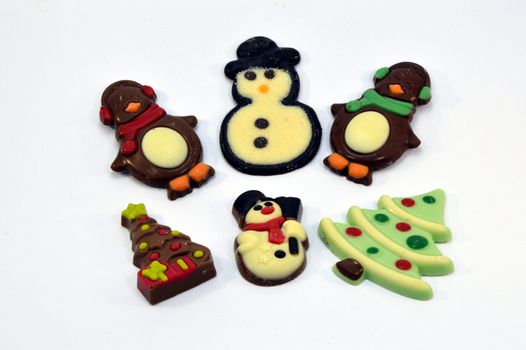 Six Belgian chocolates representing Christmas figurines