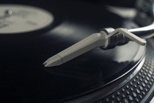 DJ mixer with a vinyl record, close up. 