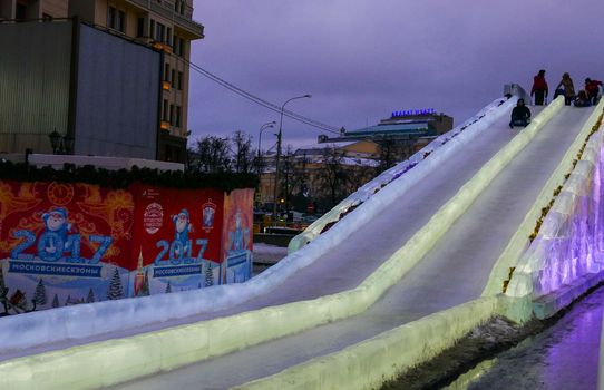 Russia Moscow in December 2016. Ice slide and children at the center of the Kremlin