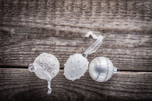 White christmas balls on a wooden background