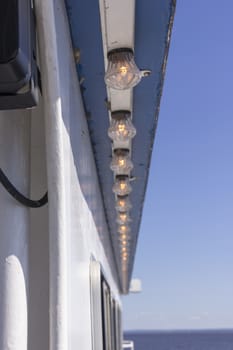 A row of lights on a cruise ship.