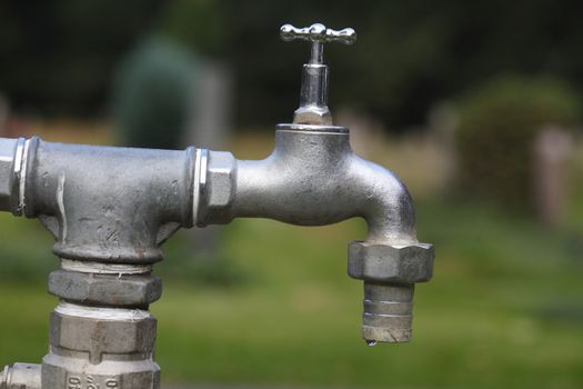 metal water tap in garden