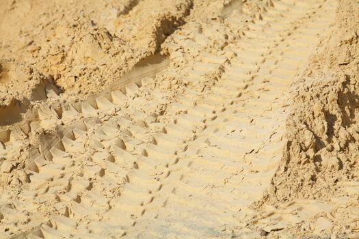 Exclavator Tracks in the  Sand