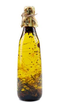 Bottle of Handmade Olive Oil with Rosemary, Saffron and Coriander isolated on White background