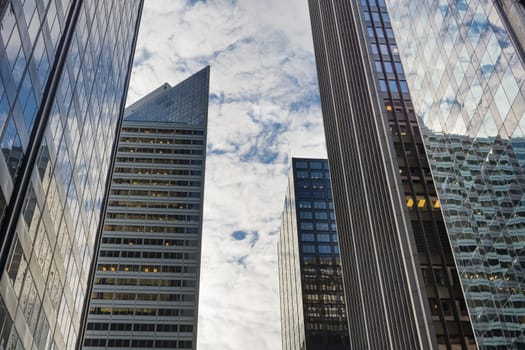 Chicago downtown skyscrapers looking up a cloudy sky