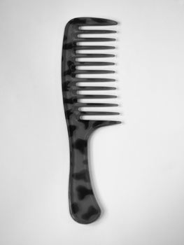 BLACK AND WHITE PHOTO OF LEOPARD PATTERN COMB