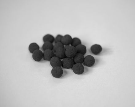 BLACK AND WHITE PHOTO OF TURMERIC BALLS