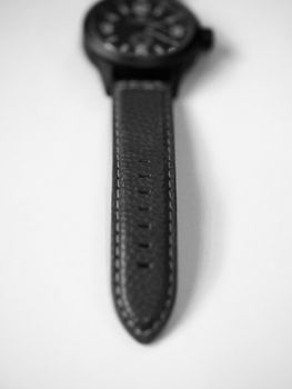 BLACK AND WHITE PHOTO OF LEATHER WATCH STRAP