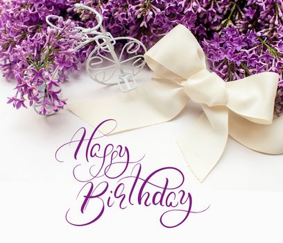 Illustration of bouquet from lilac lilies with text Happy Birthday. Calligraphy lettering.